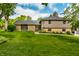 Charming home with manicured lawn, stone accents, and gray siding, offering great curb appeal at 224 Brierley Way, Carmel, IN 46032