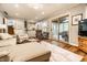 Cozy living room featuring comfortable seating, wood floors, and a view of the outdoor space for relaxing at 224 Brierley Way, Carmel, IN 46032
