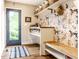 Convenient mud room with ample storage, shelving, and bench, perfect for organizing outdoor gear and pet accessories at 224 Brierley Way, Carmel, IN 46032