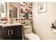 Charming powder room with designer wallpaper, modern vanity, and sleek fixtures at 224 Brierley Way, Carmel, IN 46032