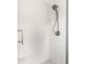 Contemporary shower with white subway tile, a sleek showerhead, and a built-in niche at 224 Brierley Way, Carmel, IN 46032