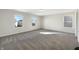 This cozy room has three windows that brings in plenty of natural light, highlighting the fresh paint and comfortable carpet at 2350 Bridlewood Dr, Franklin, IN 46131