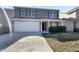 Charming two-story home with a two car garage and gray siding at 2350 Bridlewood Dr, Franklin, IN 46131