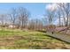 This grassy yard features a fence, mature trees, and ample space for outdoor activities at 251 Howard Rd, Greenwood, IN 46142