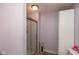 Bathroom with a glass enclosed shower, toilet, and white storage cabinets at 251 Howard Rd, Greenwood, IN 46142