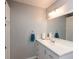 Clean bathroom featuring modern vanity, ample storage, and a large mirror at 251 Howard Rd, Greenwood, IN 46142