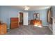 Spacious bedroom with neutral carpet, light blue walls, and a matching dresser and vanity at 251 Howard Rd, Greenwood, IN 46142