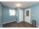 Comfortable bedroom with light blue walls and wood flooring at 251 Howard Rd, Greenwood, IN 46142