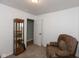Bedroom with a chair, wooden display case and carpet at 251 Howard Rd, Greenwood, IN 46142