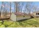 Spacious detached garage on a well-maintained lawn, accented by tall trees at 251 Howard Rd, Greenwood, IN 46142