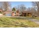 Charming home featuring brick accents, a covered porch, a lawn, and an attached garage at 251 Howard Rd, Greenwood, IN 46142