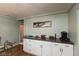 Kitchen featuring white cabinets, a coffee maker, and a food preparation area at 251 Howard Rd, Greenwood, IN 46142
