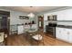 Bright kitchen with stainless steel appliances, adjacent to a dinette with glass table and seating at 251 Howard Rd, Greenwood, IN 46142