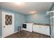 Well-lit laundry room featuring modern appliances, cabinets, and light blue walls at 251 Howard Rd, Greenwood, IN 46142