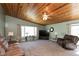 Bright living room featuring a window, plush carpet, a ceiling fan and comfortable furniture at 251 Howard Rd, Greenwood, IN 46142