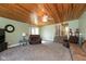 Spacious living room with wood ceiling, ceiling fan, and plush carpet offers a cozy gathering space at 251 Howard Rd, Greenwood, IN 46142