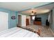 Spacious main bedroom with a ceiling fan, carpeted floors, and an en-suite area at 251 Howard Rd, Greenwood, IN 46142