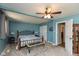 Spacious main bedroom featuring a ceiling fan, carpet, and a bed with an iron frame at 251 Howard Rd, Greenwood, IN 46142
