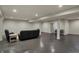 Large finished basement with neutral walls and floors, with seating area at 2753 Stones Bay Dr, Greenwood, IN 46143