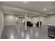 Partially furnished basement with concrete flooring and neutral gray walls at 2753 Stones Bay Dr, Greenwood, IN 46143