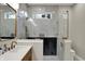 This bathroom is equipped with marble walls, a walk-in shower, and -and- sinks at 2753 Stones Bay Dr, Greenwood, IN 46143