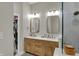 This bathroom features double sinks, wood cabinets, and a large shower at 2753 Stones Bay Dr, Greenwood, IN 46143