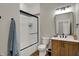 Modern bathroom with a glass-enclosed shower, single sink, and white subway tile at 2753 Stones Bay Dr, Greenwood, IN 46143