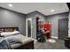 A modern bedroom featuring a single bed, stylish shelving, and cool decor at 2753 Stones Bay Dr, Greenwood, IN 46143