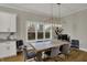Bright dining room featuring a modern chandelier, natural light, and neutral decor at 2753 Stones Bay Dr, Greenwood, IN 46143