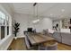 Open-concept dining room with hardwood floors and a modern chandelier at 2753 Stones Bay Dr, Greenwood, IN 46143