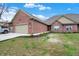 Beautiful red brick exterior home with 2 car garage, and manicured lawn and landscaping at 2753 Stones Bay Dr, Greenwood, IN 46143