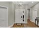 Inviting foyer with a modern chandelier, light gray walls, and beautiful flooring at 2753 Stones Bay Dr, Greenwood, IN 46143