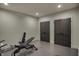 Home gym with weight bench and neutral walls and concrete floors at 2753 Stones Bay Dr, Greenwood, IN 46143
