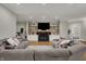 Cozy living room featuring a modern fireplace, built-in shelves, and comfortable seating at 2753 Stones Bay Dr, Greenwood, IN 46143