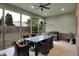 View of screened patio features a dining set, grill, and view of the backyard at 2753 Stones Bay Dr, Greenwood, IN 46143