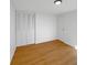 Clean, empty bedroom with hardwood floors, closet, and a window at 2928 Sheffield Dr, Indianapolis, IN 46229