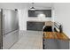 Kitchen featuring stainless steel appliances, gray cabinets, and wood countertops at 2928 Sheffield Dr, Indianapolis, IN 46229