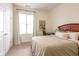 Well-lit bedroom with neutral tones and a comfortable bed, next to a window and workspace at 355 E Ohio St # 221, Indianapolis, IN 46204