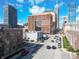 Busy city street framed by modern buildings in downtown Indianapolis at 355 E Ohio St # 221, Indianapolis, IN 46204