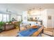 Open-concept living space featuring a large dining table adjacent to the kitchen and living room at 355 E Ohio St # 221, Indianapolis, IN 46204