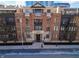 Apartment building with brick facade, balconies, and well-maintained landscaping at 355 E Ohio St # 221, Indianapolis, IN 46204