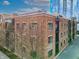Brick building featuring sleek lines, modern windows, and an accessible rooftop terrace at 355 E Ohio St # 221, Indianapolis, IN 46204