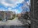 Street view of brick townhouses and green lawns, featuring a well-maintained neighborhood and landscaping at 355 E Ohio St # 221, Indianapolis, IN 46204