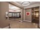 Hallway with mailboxes, modern lighting, and an adjacent hallway and doorway at 355 E Ohio St # 221, Indianapolis, IN 46204