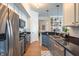 Updated kitchen with stainless appliances, gray cabinets, and granite counters at 355 E Ohio St # 221, Indianapolis, IN 46204