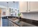 Kitchen with stainless steel sink, granite countertops, and stylish cabinetry at 355 E Ohio St # 221, Indianapolis, IN 46204