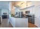 Modern kitchen with stainless steel appliances, gray cabinets, and a breakfast bar at 355 E Ohio St # 221, Indianapolis, IN 46204
