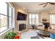 Bright living room with a decorative fireplace, lots of natural light, and comfortable seating at 355 E Ohio St # 221, Indianapolis, IN 46204
