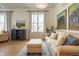 Comfortable living room with sofa, ottoman, stylish decor, and plenty of natural light at 355 E Ohio St # 221, Indianapolis, IN 46204