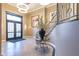 Lobby entrance with a glass door, staircase, modern lighting, and a decorative flower display at 355 E Ohio St # 221, Indianapolis, IN 46204